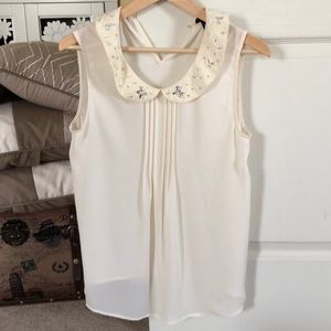No sleeve ivory blouse